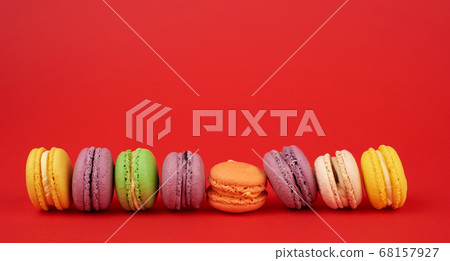 pile of multi-colored baked macarons almond flour 68157927