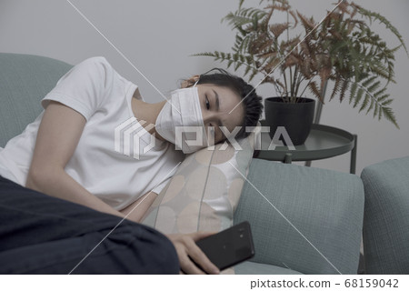 Sick girl wearing a mask Sick girl wearing a mask 68159042