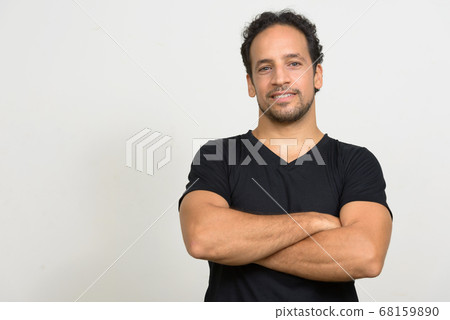 Portrait of handsome bearded Hispanic man with curly hair Portrait of handsome bearded Hispanic man with curly hair 68159890