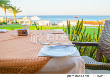 restaurant table and setting place with romantic 68160488