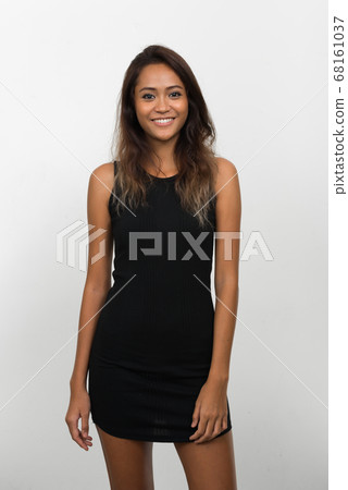 Happy young beautiful Asian woman with brown hair 68161037