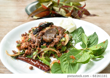 Thai spicy chop duck meat salad eat couple  fresh cabbage and Vietnamese coriander on plate 68161181