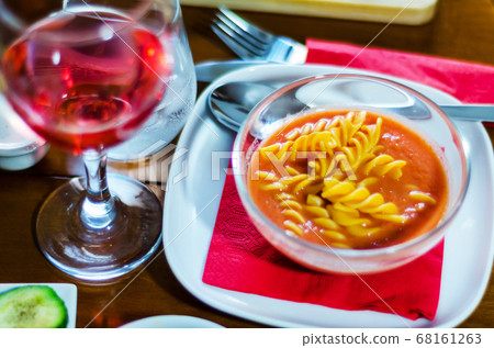 tasty and nutritious tomato soup with fresh pasta, 68161263