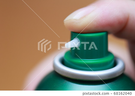 Senior finger spraying a spray can 68162040