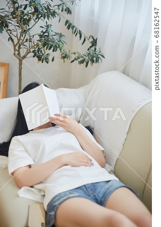 Young woman enjoying leisure at home Young woman enjoying leisure at home 68162547