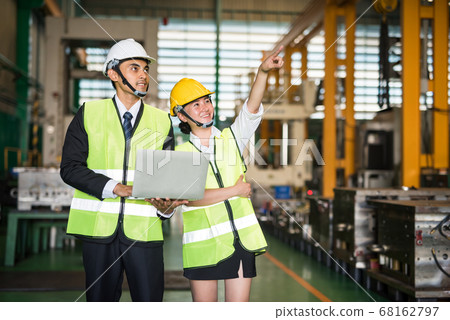 2 Happy factory inspector in warehouse. teamwork 68162797