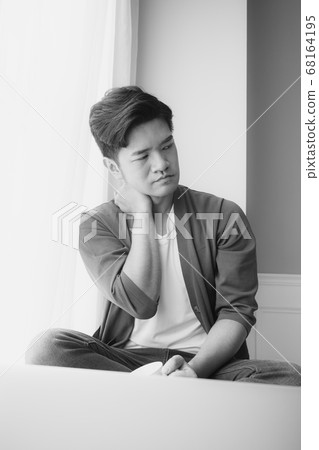 Asian man having a shoulder pain Asian man having a shoulder pain 68164195