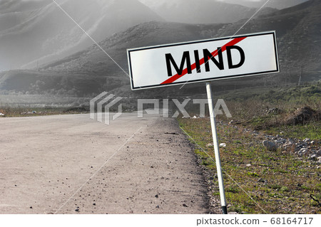 Road and road sign crossed out word "Mind". Road and road sign crossed out word "Mind". 68164717