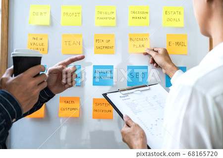 Two creative Business people meeting and planning 68165720