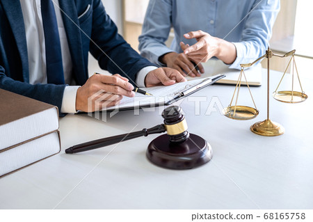 Businesswoman and Male lawyer or judge consult and Businesswoman and Male lawyer or judge consult and 68165758
