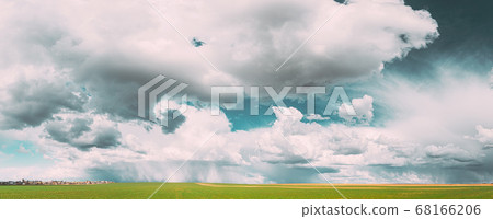 Countryside Rural Field Meadow Landscape In Sunny Rainy Spring Day. Scenic Sky With Rain Clouds On Horizon. Agricultural And Weather Forecast Concept. Panorama 68166206