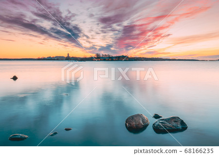 Helsinki, Finland. Panorama Panoramic View Of Suomenlinna Church In Fortress Of Suomenlinna Or Sveaborg And Partially Fortified Island Harakka On Sunrise Sunset Time Helsinki, Finland. Panorama Panoramic View Of Suomenlinna Church In Fortress Of Suomenlinna Or Sveaborg And Partially Fortified Island Harakka On Sunrise Sunset Time 68166235