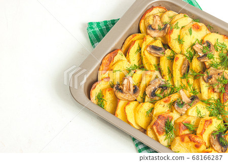 Potato wedges baked with mushrooms, herb oven 68166287