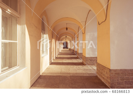 Exterior open vaulted arcade gallery. 68166813