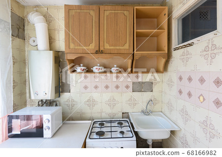 A fragment of an old kitchen set in the interior A fragment of an old kitchen set in the interior 68166982