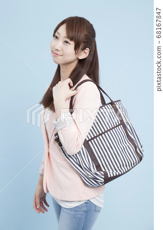 Smiling female college student Smiling female college student 68167847