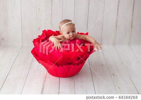 Little girl in handmade paper flower. Little girl in handmade paper flower. 68168268