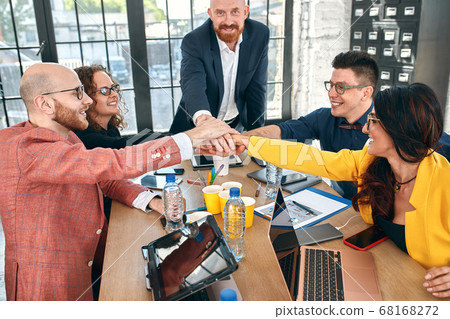 Group of joyful smiling happy people celebrate win with arms up. Mediation offer high five friendship deal achievement strike bargain good news friendly consent successful effective strategy 68168272