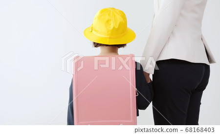 Girl going to school with mom 68168403
