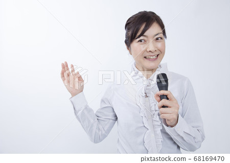 Female lecturer giving a lecture Female lecturer giving a lecture 68169470