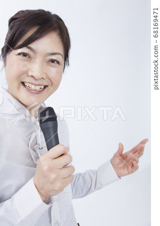 Female lecturer giving a lecture Female lecturer giving a lecture 68169471
