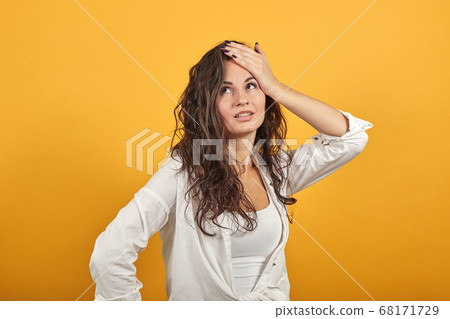 Stress or a headache grimacing in pain holds back of neck indicating location 68171729