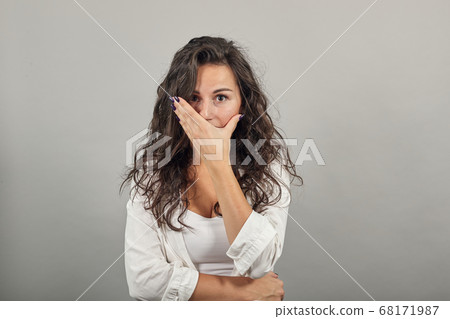 Covering mouth with palm. Can't say anything. Shocked gasping amazed hearing Covering mouth with palm. Can't say anything. Shocked gasping amazed hearing 68171987