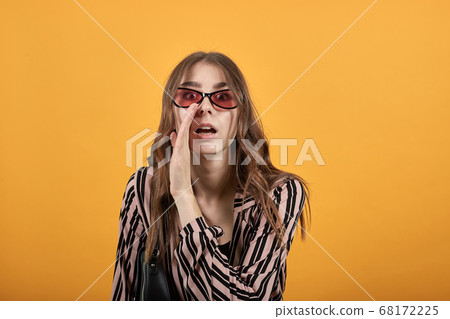 Talking Girl Tells Gossip In Secret, Holds The Palm Of Hand To Her Mouth 68172225