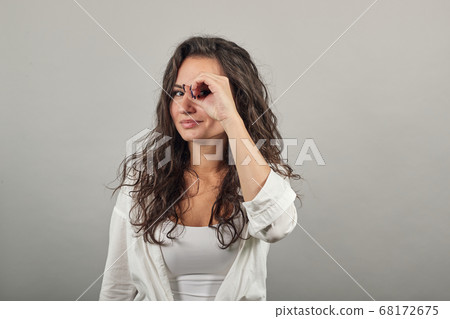 Making glasses of fingers, looking at camera smiling, funny, hold hands eyes 68172675