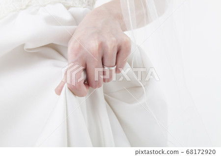 Bride with dress hem Bride with dress hem 68172920