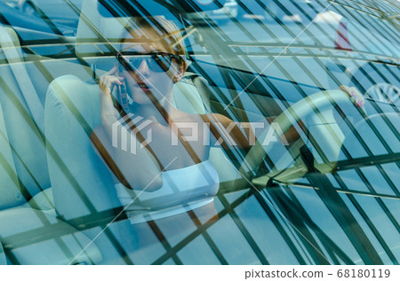 Woman driving a car Woman driving a car 68180119