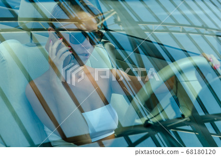 Woman driving a car Woman driving a car 68180120