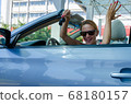 Woman driving a car 68180157