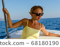 Red woman on a yacht cruise 68180190