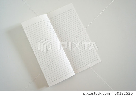 A5 slim size notebook spread on a white table (6 mm wide horizontal ruled line) 68182520