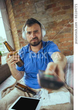 Lazy man living the whole life in his bed surrounded with messy Lazy man living the whole life in his bed surrounded with messy 68184771