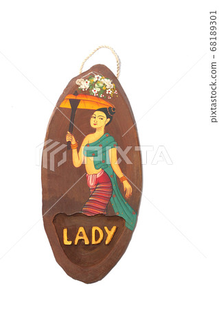 Lady toilet sign. Natural teak wood restroom sign paint Thai art handcraft decorate toilet woman sign isolated on white background Lady toilet sign. Natural teak wood restroom sign paint Thai art handcraft decorate toilet woman sign isolated on white background 68189301