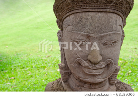 Spider on statue face at Angkor wat , Angkor Thom temple in Siem Reap city , Cambodia. Popular famous tourist attraction in Cambodia Spider on statue face at Angkor wat , Angkor Thom temple in Siem Reap city , Cambodia. Popular famous tourist attraction in Cambodia 68189306