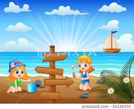 Happy little girls playing sea sand 68189358