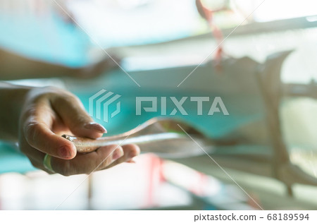 Woman working on weaving machine for weave 68189594