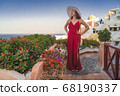 Europe Greece Santorini travel vacation woman on famous santorini Oia island travel destination. Happy young tourist woman. Summer wanderlust. 68190337