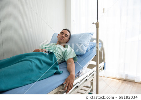 Young Man Lying On Bed At Hospital Young Man Lying On Bed At Hospital 68192034