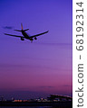 Plane landing at sunset time 68192314