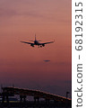Plane landing at sunset time 68192315