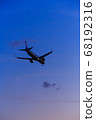 Plane landing at sunset time 68192316