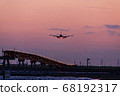 Plane landing at sunset time 68192317