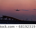 Plane landing at sunset time 68192319