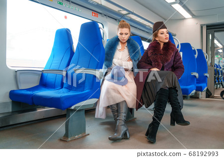 Two female friends on the train Two female friends on the train 68192993