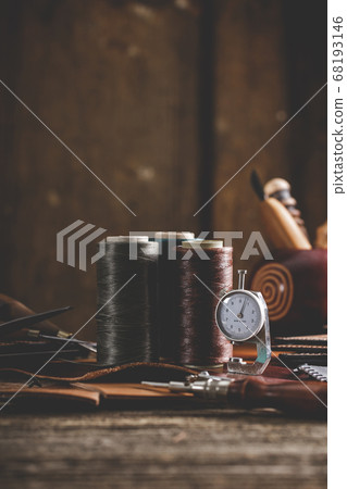 Leather craft tools on old wood table. Leather craft workshop. Leather craft tools on old wood table. Leather craft workshop. 68193146