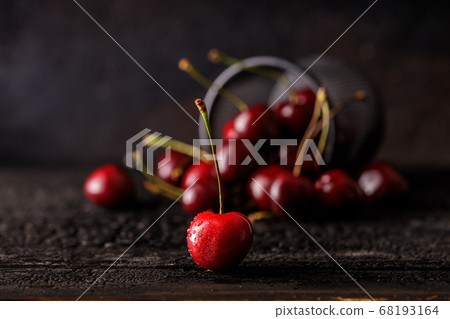still life of red, juicy cherries on a dark background. Group of cherry. 68193164